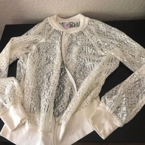 white zip up see-through jacket